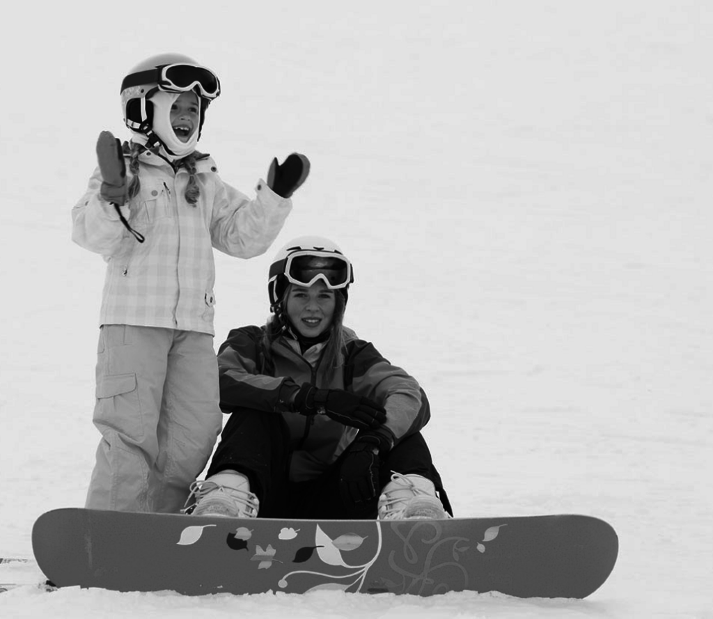 two kid snowboarders