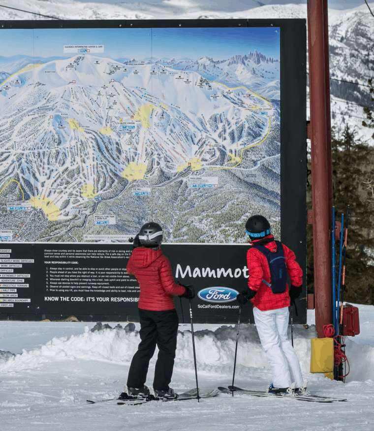two women looking at trail map