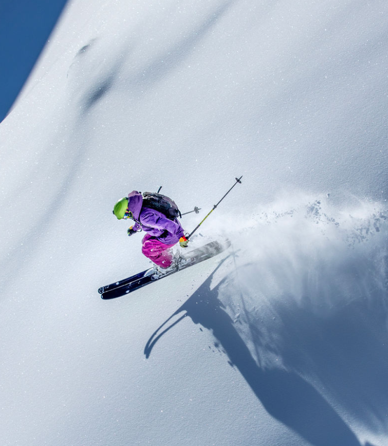 person jumping while skiing